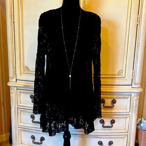 Selling a beautiful lace blouse. Never wore. Price is set price.No necklace